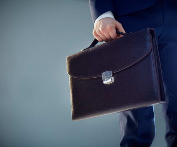Isolated image of a businessman carrying a briefcase